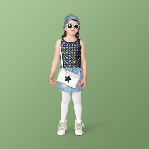 Apparel mockup of a girl wearing a tank top with a pattern from the Retro Jungle Collection by Elisa Mink.